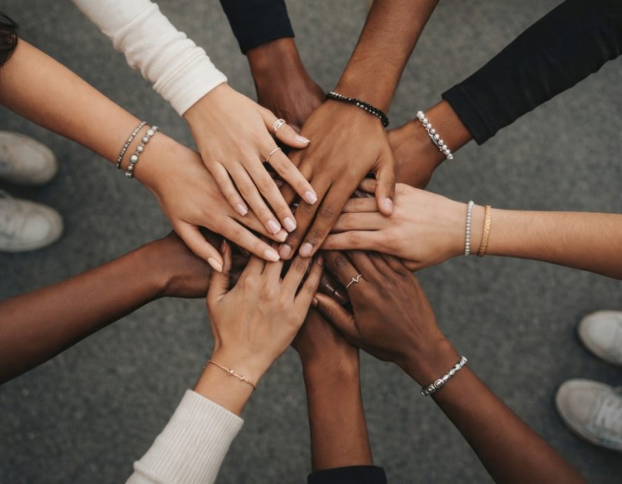 Diverse hands united together. Diverse hands united together.