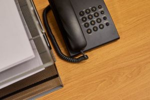 old phone system lying on the desk